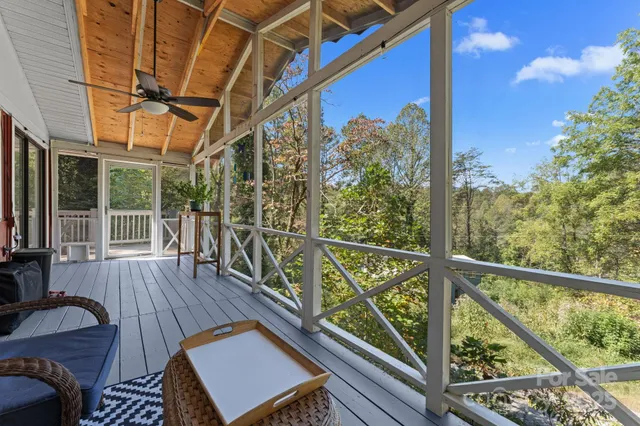 a view of a balcony with wooden floor