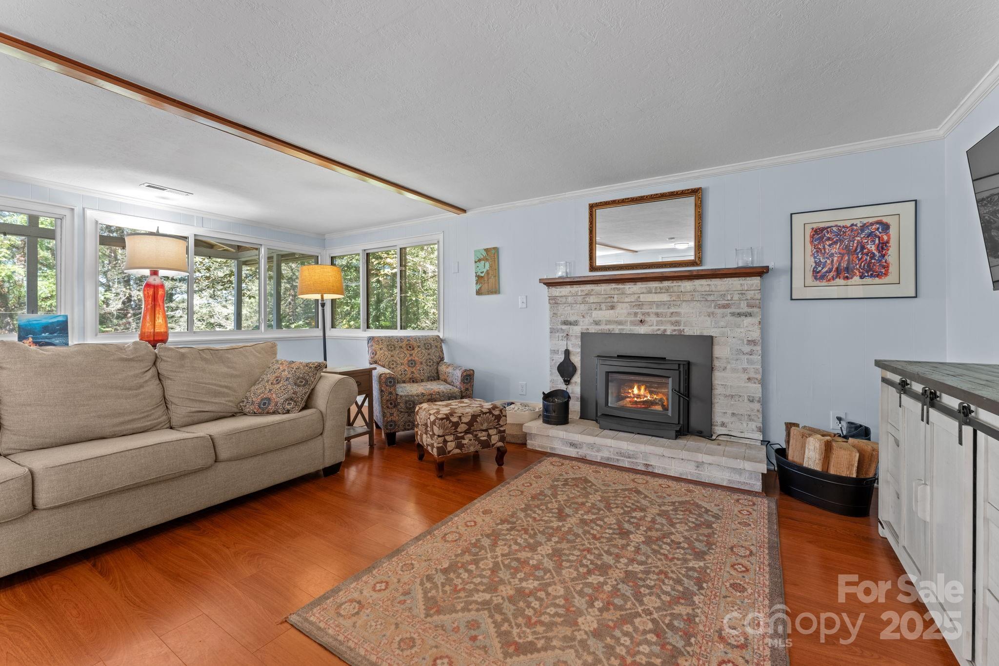 30 Maxies Corner Road Franklin, NC 28734 - Photo 11 of 33 a living room with furniture and a fireplace