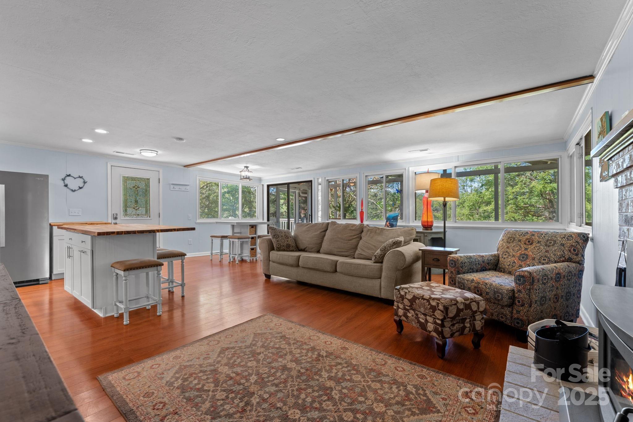 30 Maxies Corner Road Franklin, NC 28734 - Photo 12 of 33 a living room with furniture wooden floor and a large window