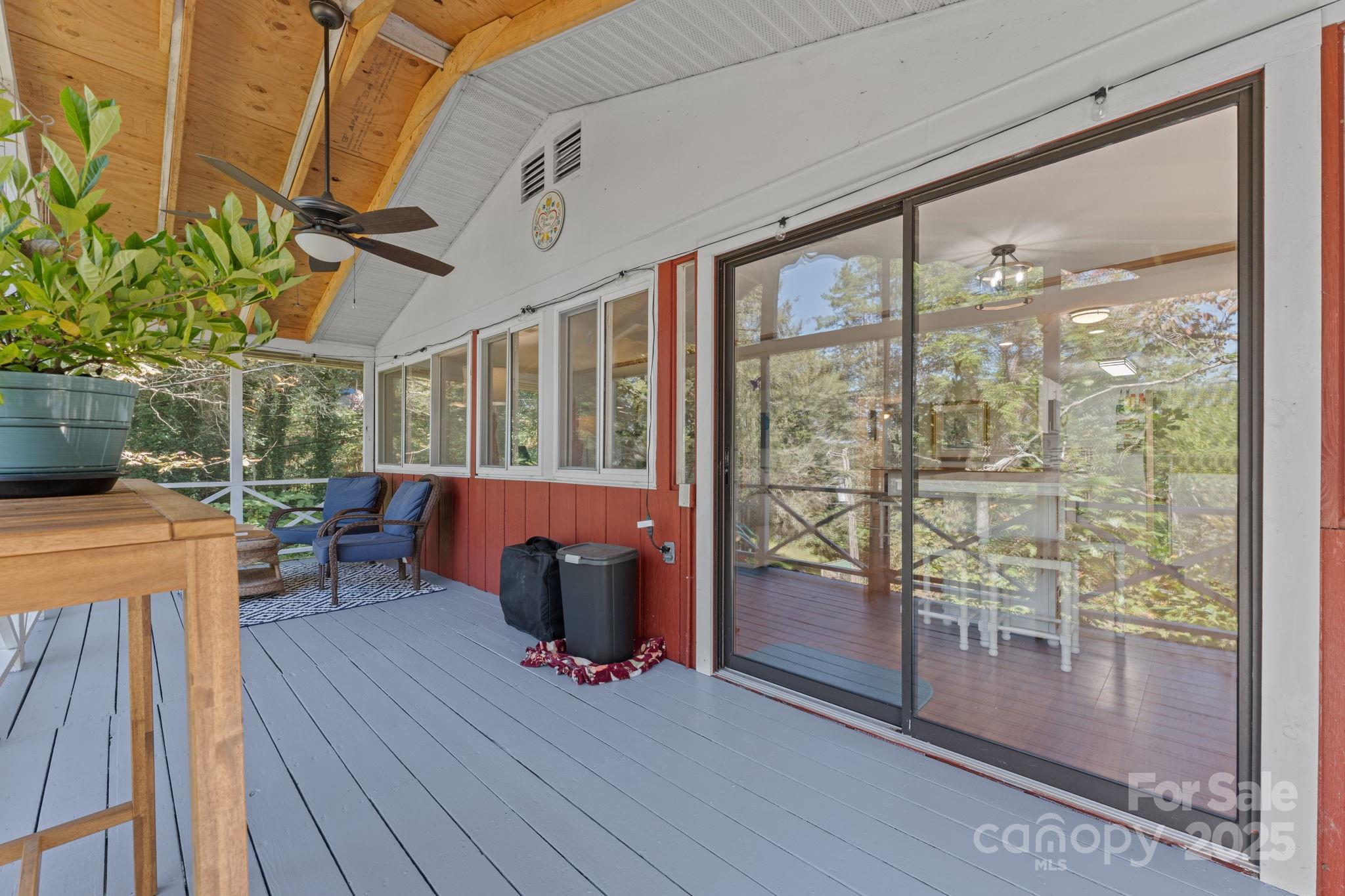 30 Maxies Corner Road Franklin, NC 28734 - Photo 15 of 33 a view of a porch with furniture and wooden floor