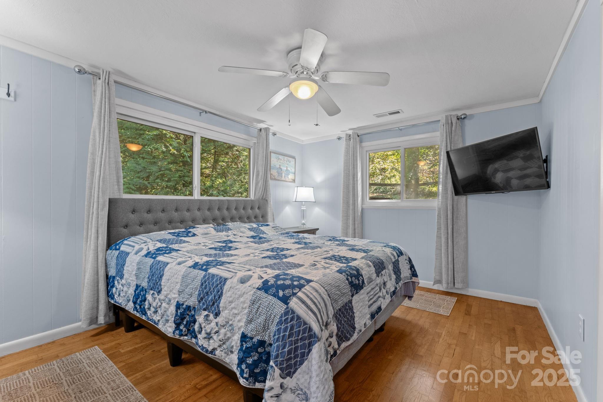 30 Maxies Corner Road Franklin, NC 28734 - Photo 16 of 33 a bedroom with a bed and a flat tv screen on dresser