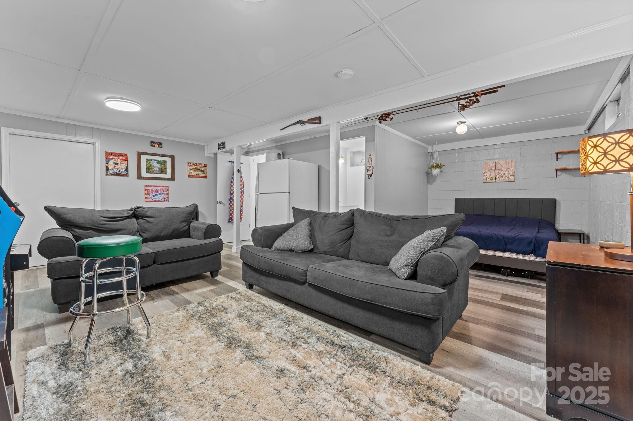 30 Maxies Corner Road Franklin, NC 28734 - Photo 21 of 33 a living room with furniture and a flat screen tv