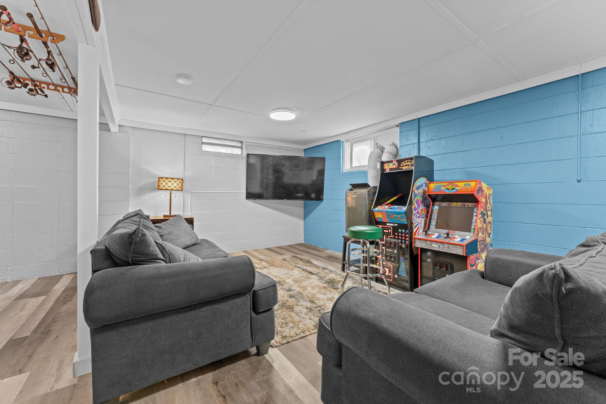 30 Maxies Corner Road Franklin, NC 28734 - Photo 22 of 33 a living room with furniture and a flat screen tv