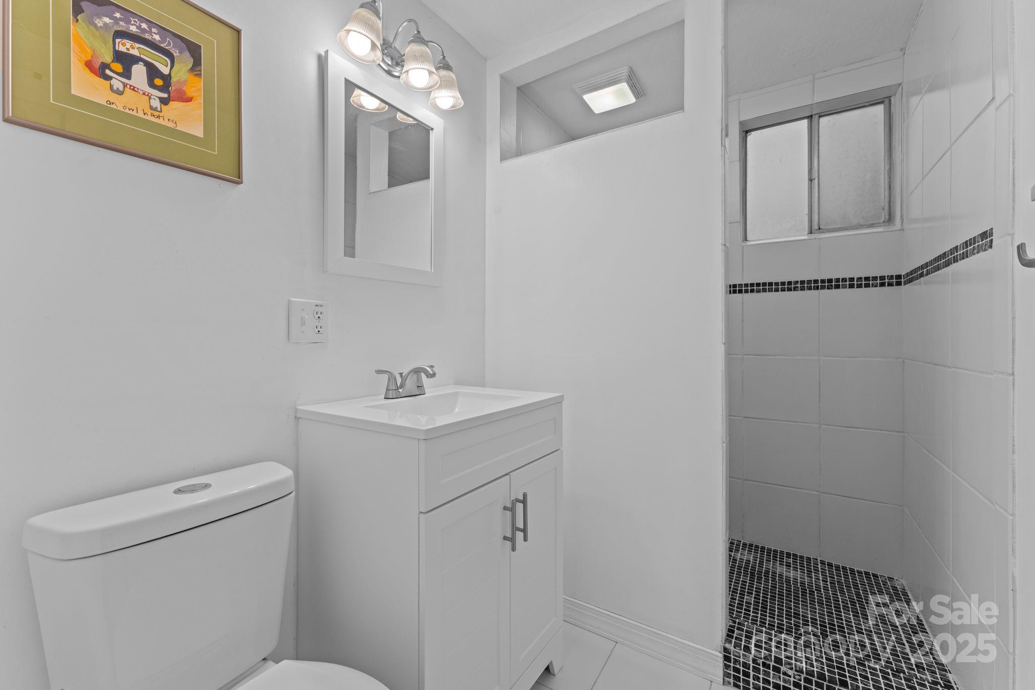 30 Maxies Corner Road Franklin, NC 28734 - Photo 24 of 33 a bathroom with a sink a toilet and shower