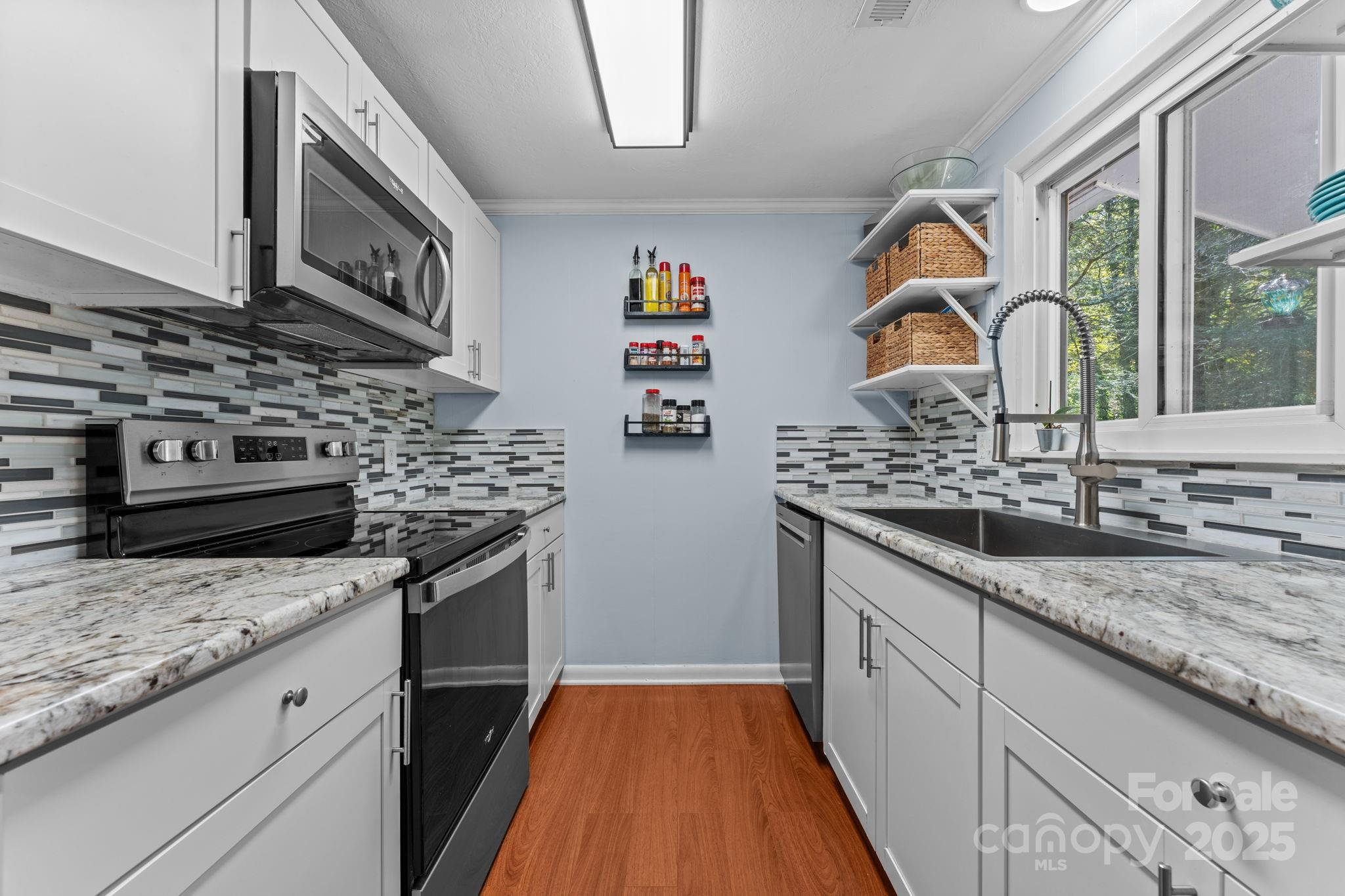 30 Maxies Corner Road Franklin, NC 28734 - Photo 5 of 33 a kitchen with stainless steel appliances granite countertop a stove and a sink