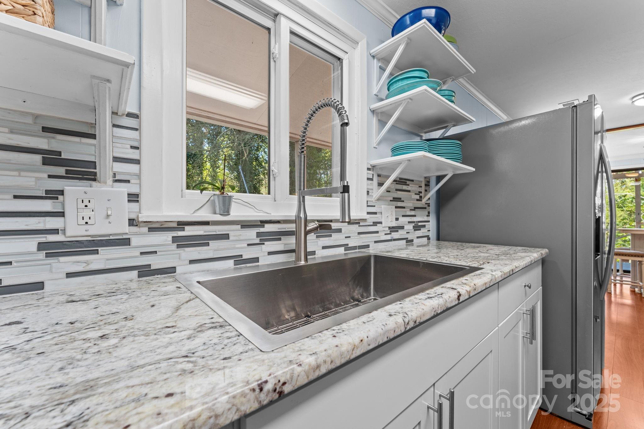 30 Maxies Corner Road Franklin, NC 28734 - Photo 6 of 33 a kitchen with a stove a sink and a window