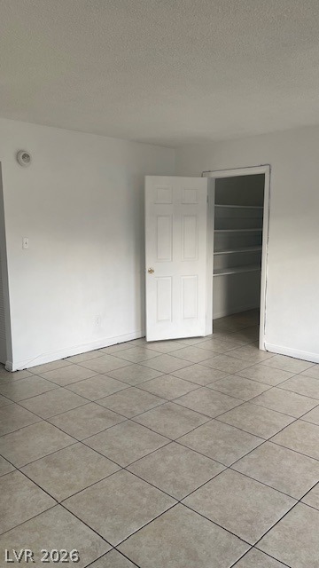 350 East Desert Inn Road, Unit B103 Las Vegas, NV 89109 - Photo 21 of 22 A versatile interior space featuring durable tile flooring, ready for personalized design.