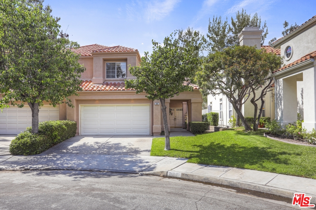 889 C. Amable Glendale, CA 91208 - Photo 2 of 51 a front view of a house with a yard and garage