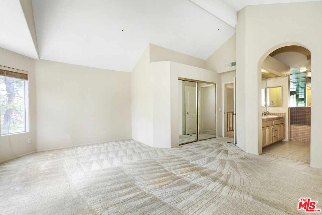 889 C. Amable Glendale, CA 91208 - Photo 25 of 51 a view of a livingroom with wooden floor and a bedroom