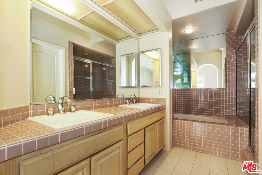 889 C. Amable Glendale, CA 91208 - Photo 26 of 51 a bathroom with a sink and a mirror