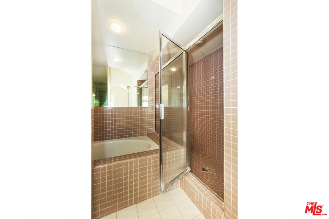 889 C. Amable Glendale, CA 91208 - Photo 27 of 51 a bathroom with a shower and a sink