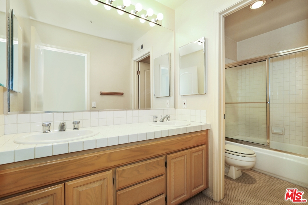 889 C. Amable Glendale, CA 91208 - Photo 31 of 51 a bathroom with a sink a toilet and shower