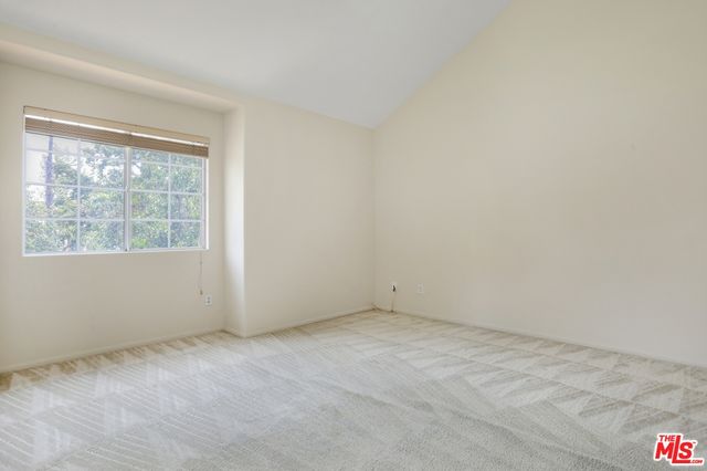 a bathroom with a shower sink vanity mirror and toilet