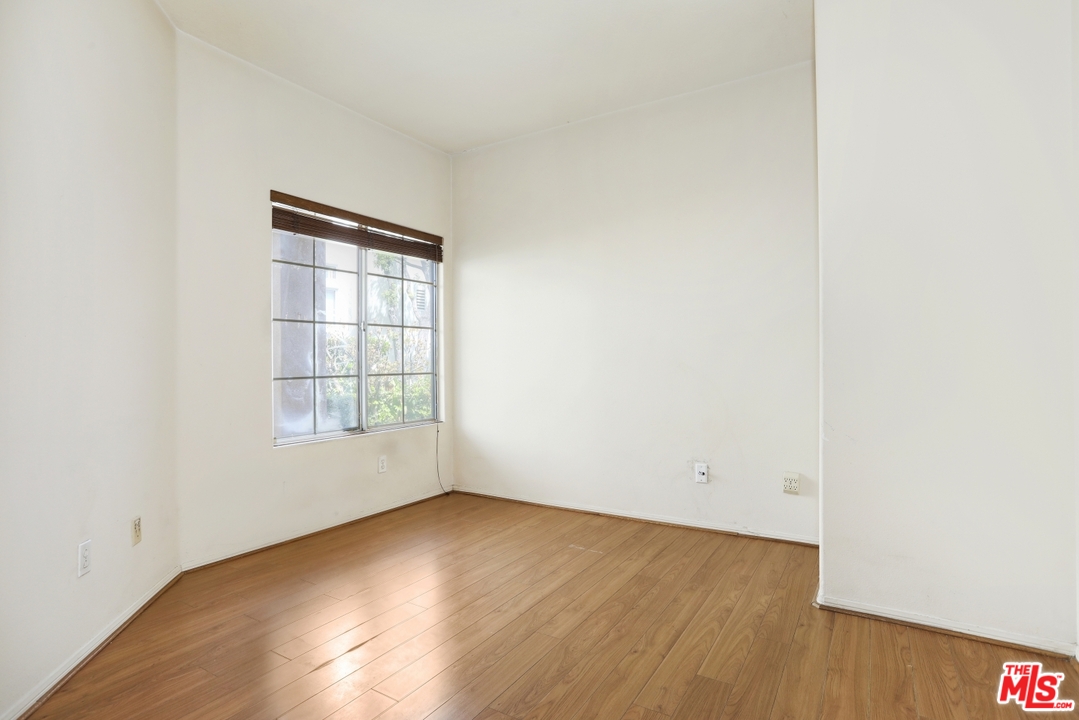 889 C. Amable Glendale, CA 91208 - Photo 35 of 51 an empty room with wooden floor and windows