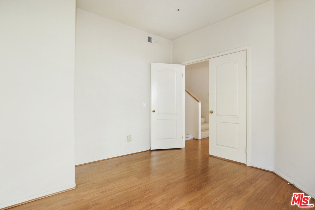 889 C. Amable Glendale, CA 91208 - Photo 36 of 51 a view of an empty room with wooden floor