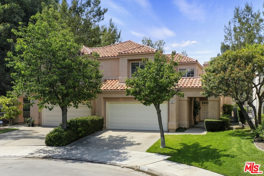 889 C. Amable Glendale, CA 91208 - Photo 42 of 51 a front view of a house with a yard and garage