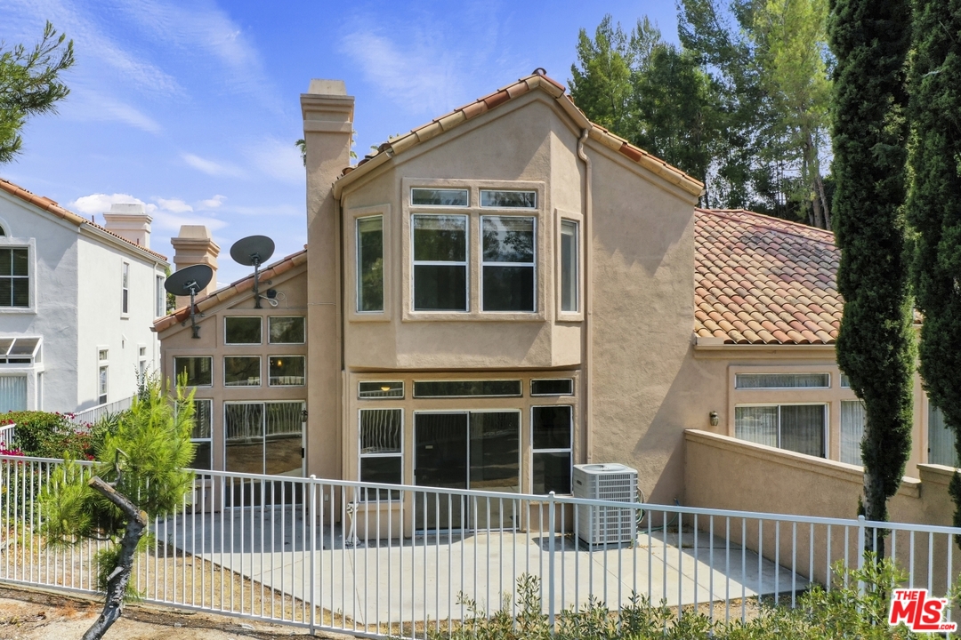 889 C. Amable Glendale, CA 91208 - Photo 46 of 51 a front view of a house with a yard