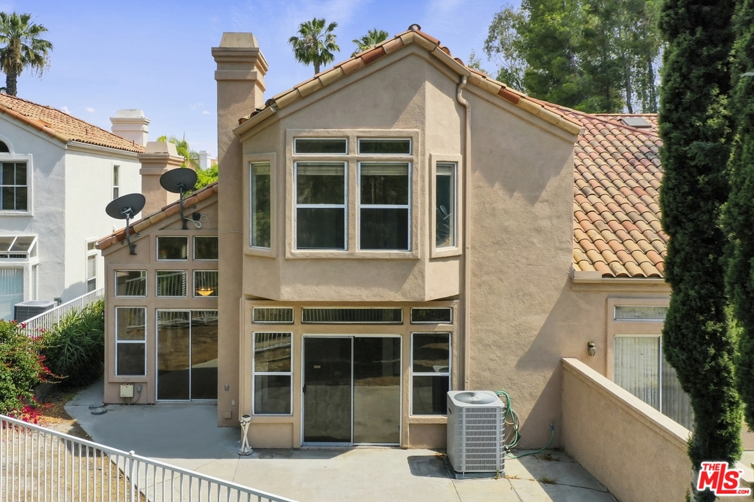 889 C. Amable Glendale, CA 91208 - Photo 47 of 51 a front view of a house with a yard