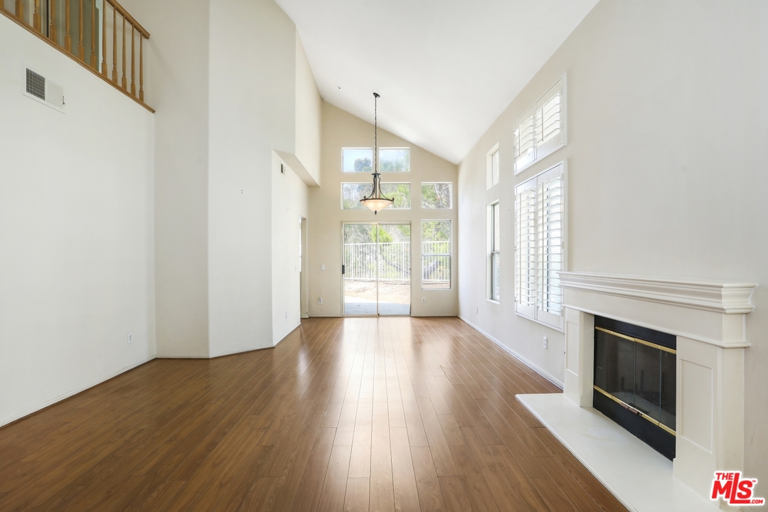 889 C. Amable Glendale, CA 91208 - Photo 7 of 51 a view of an empty room with wooden floor and a window