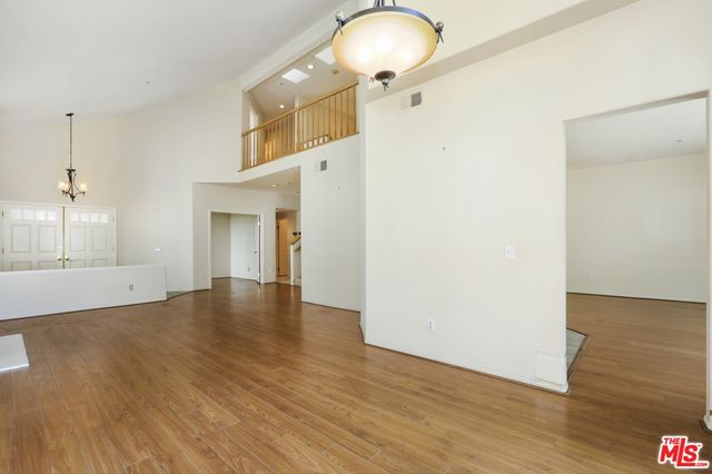 a view of an entryway with wooden floor