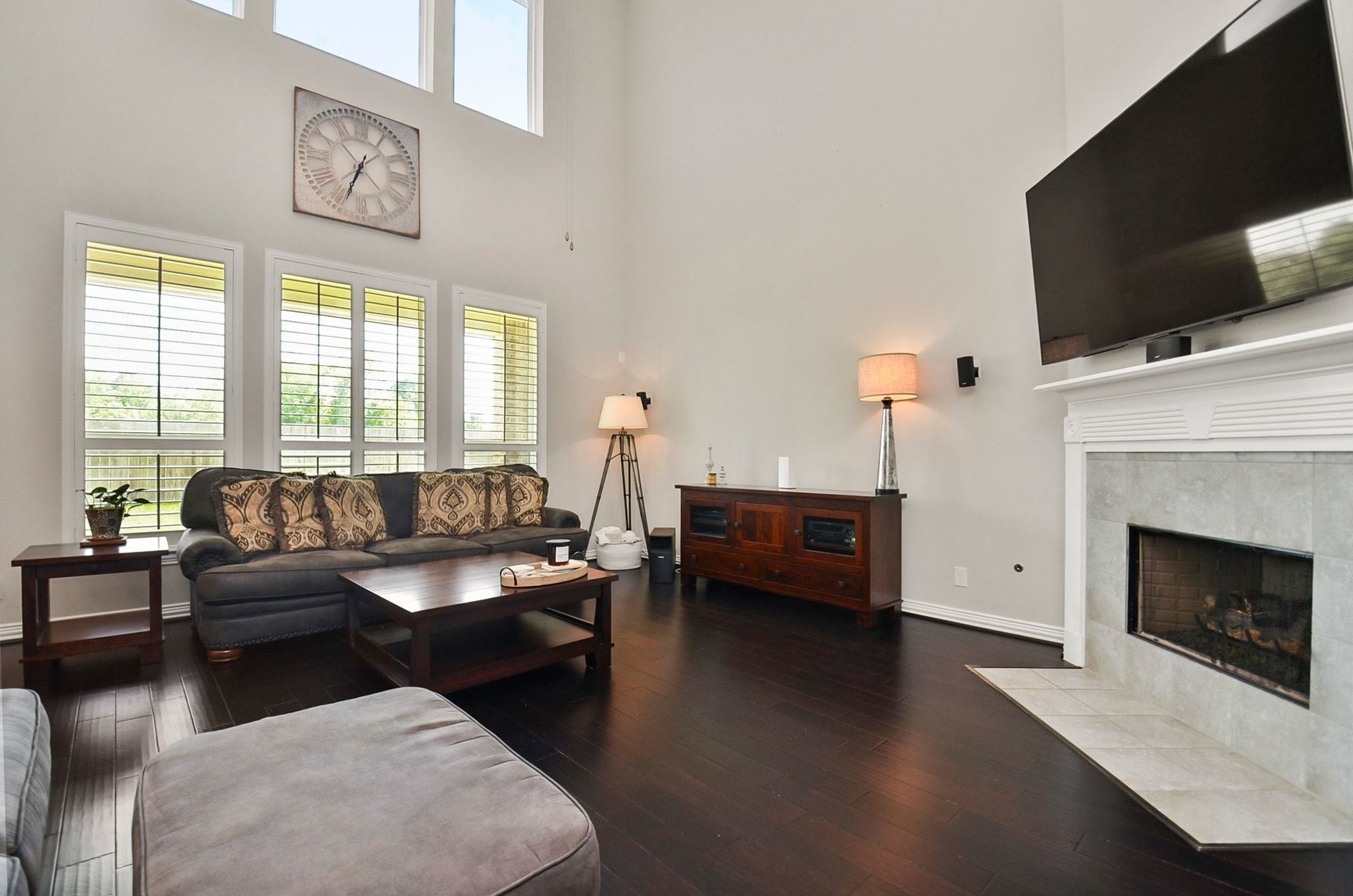 2714 Topaz Cove Lane Rosharon, TX 77583 - Photo 23 of 50 a living room with fireplace furniture and a flat screen tv