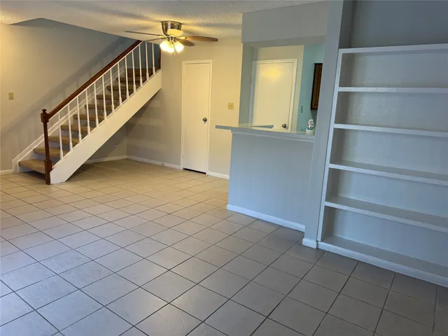 a view of a livingroom with a staircase