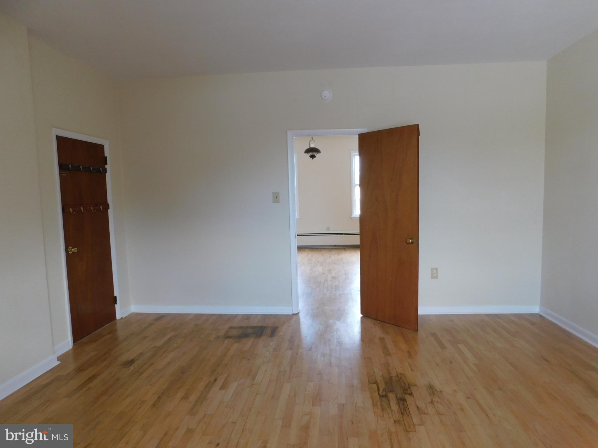 113 West Boscawen Street, Unit 3 Winchester, VA 22601 - Photo 14 of 19 a view of empty room with wooden floor