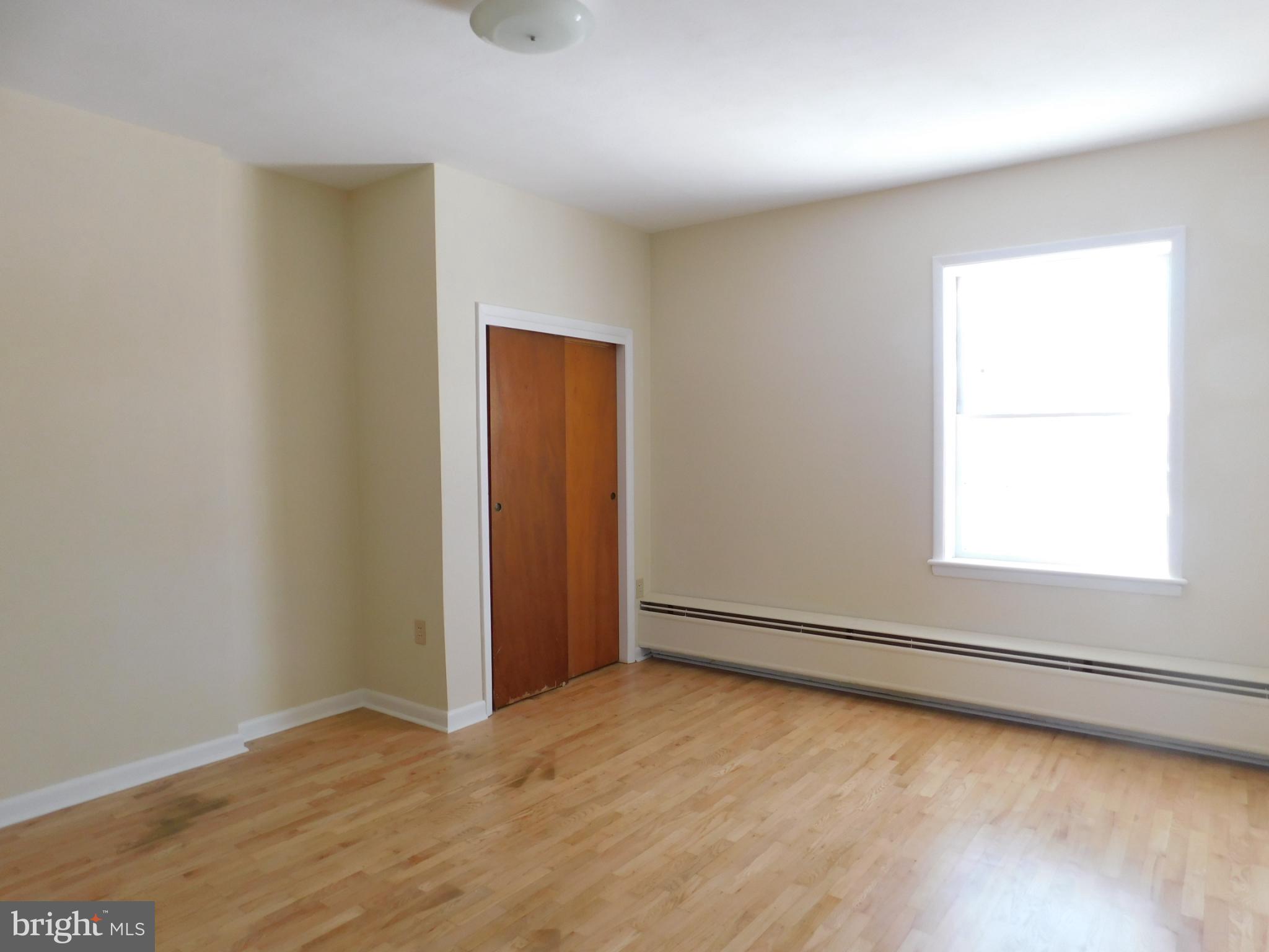 113 West Boscawen Street, Unit 3 Winchester, VA 22601 - Photo 10 of 19 an empty room with a window
