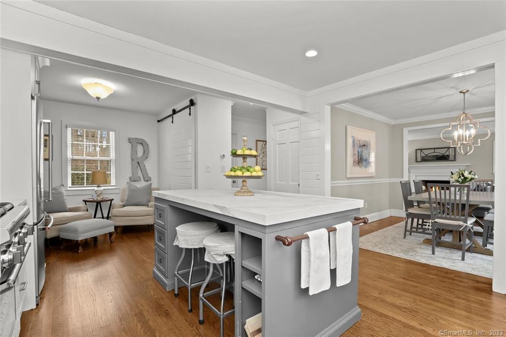 183 Frogtown Road New Canaan, CT 06840 - Photo 9 of 37 a view of a dining room with furniture and wooden floor