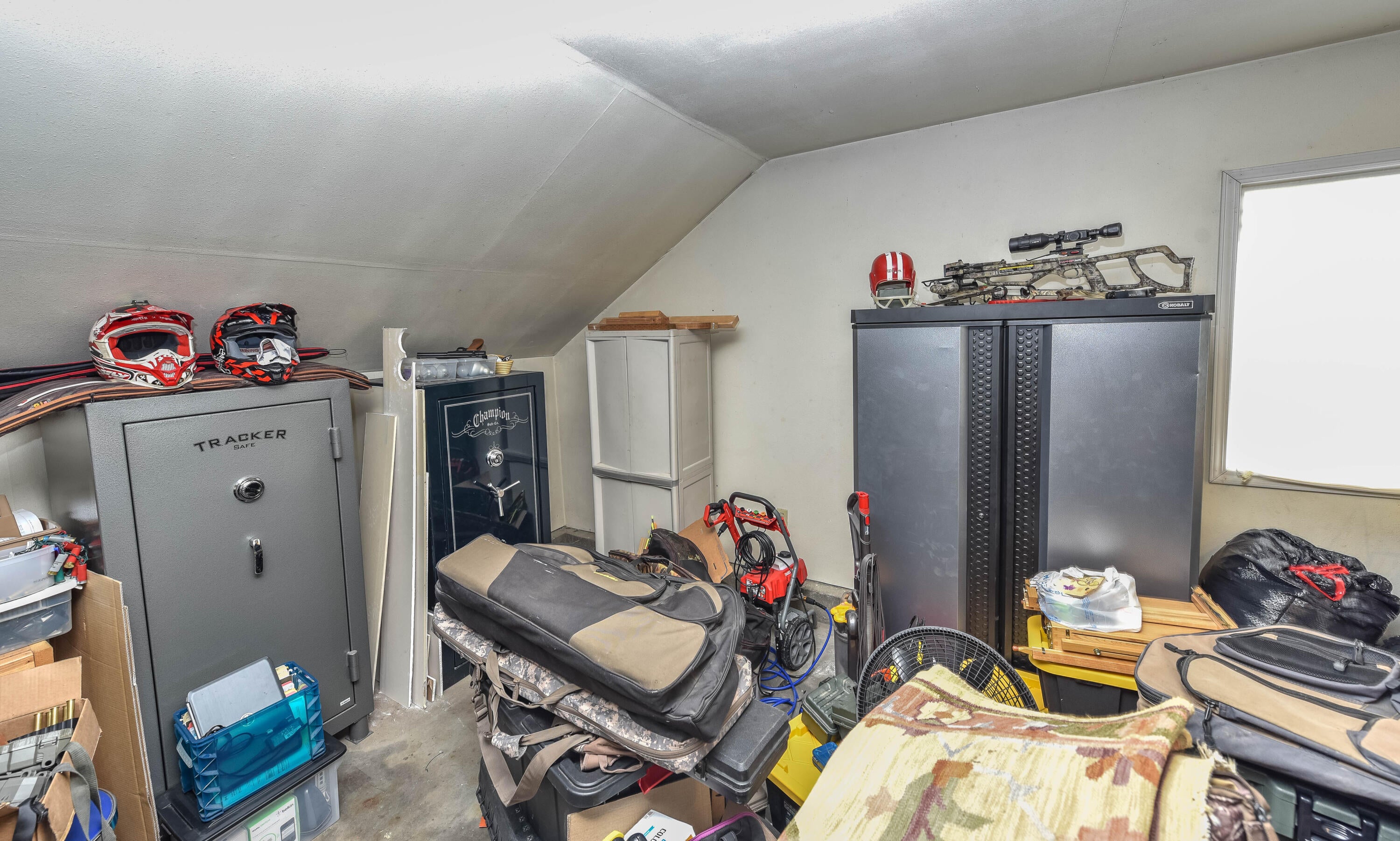 21698 Rickard Road Bend, OR 97702 - Photo 47 of 51 Garage room attached to the house has lots of storage possibilities. Two gun safes are negotiable.
