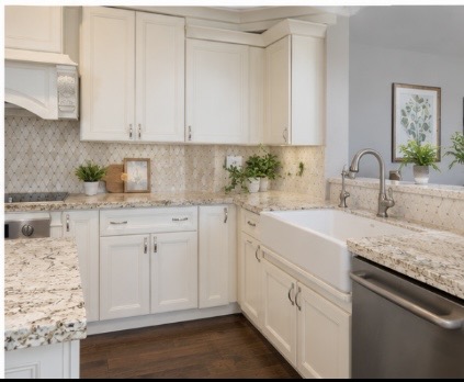 13 Oak View Round Rock, TX 78664 - Photo 9 of 30 White cabinetry, patterned backsplash, and granite countertops complete this spacious kitchen.