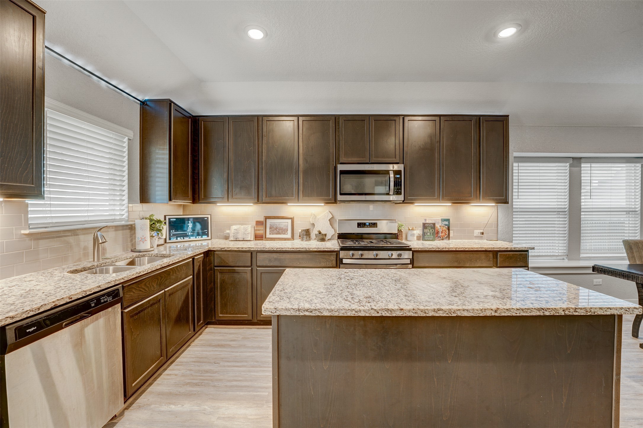 5806 Aviano Road Round Rock, TX 78665 - Photo 17 of 29 A well-appointed kitchen showcasing elegant granite countertops and modern stainless steel appliances.