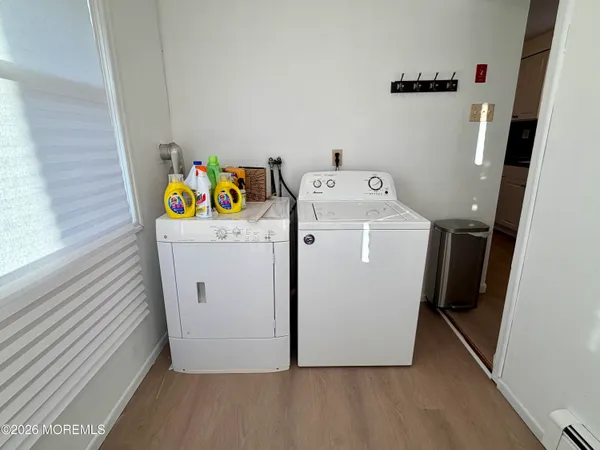 a utility room with dryer and washer