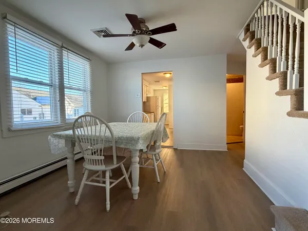 a dining room with furniture and window