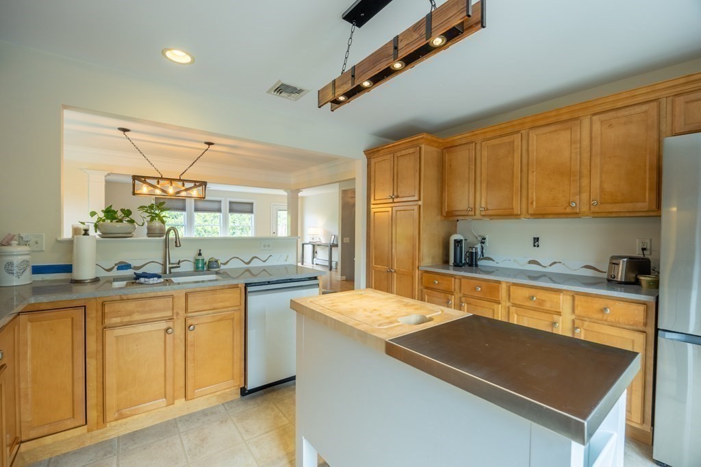 3 Harbor Mist Drive, Unit 3 Fairhaven, MA 02719 - Photo 12 of 28 a kitchen with sink cabinets and window