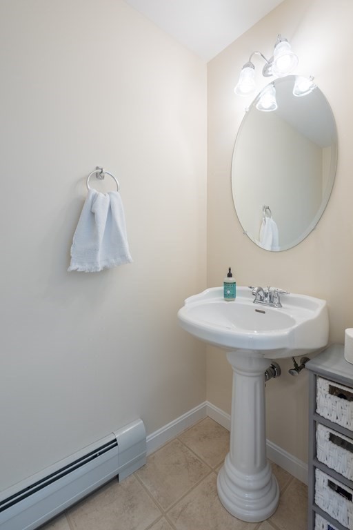 3 Harbor Mist Drive, Unit 3 Fairhaven, MA 02719 - Photo 13 of 28 a bathroom with a sink a mirror and vanity