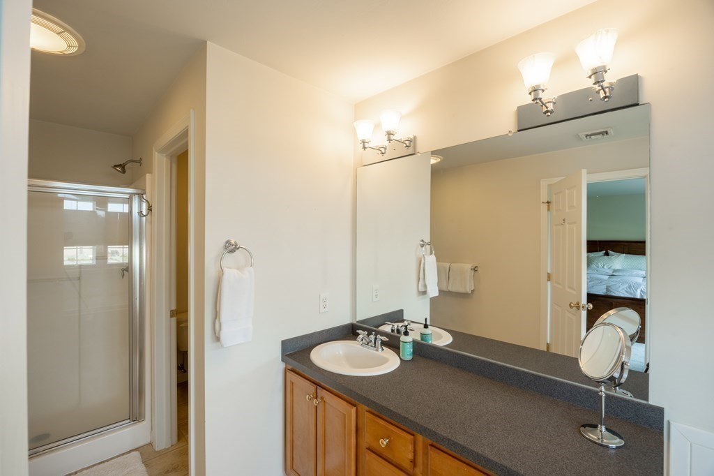 3 Harbor Mist Drive, Unit 3 Fairhaven, MA 02719 - Photo 17 of 28 a bathroom with a sink and a mirror