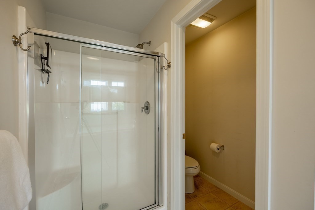 3 Harbor Mist Drive, Unit 3 Fairhaven, MA 02719 - Photo 18 of 28 a bathroom that has a glass shower door