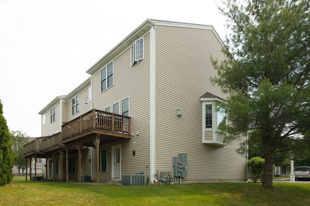 3 Harbor Mist Drive, Unit 3 Fairhaven, MA 02719 - Photo 25 of 28 a view of a house with a yard
