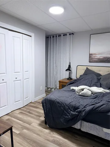 a bedroom with bed and window