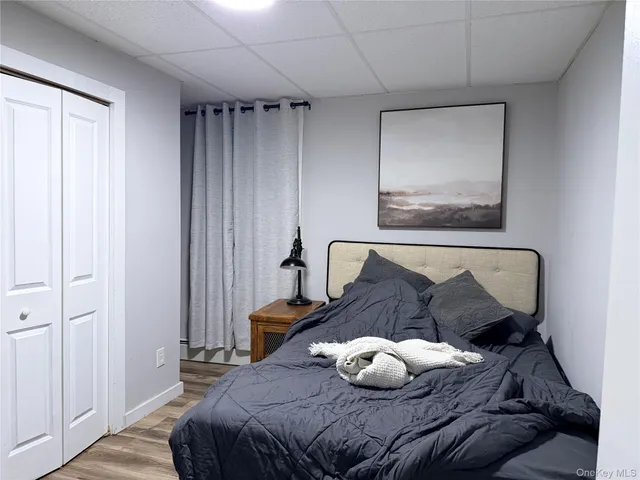 a bedroom with bed and furniture