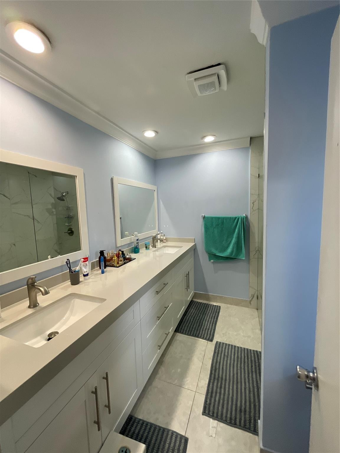 9020 Pine Springs Drive Boca Raton, FL 33428 - Photo 13 of 23 a bathroom with a sink and a mirror