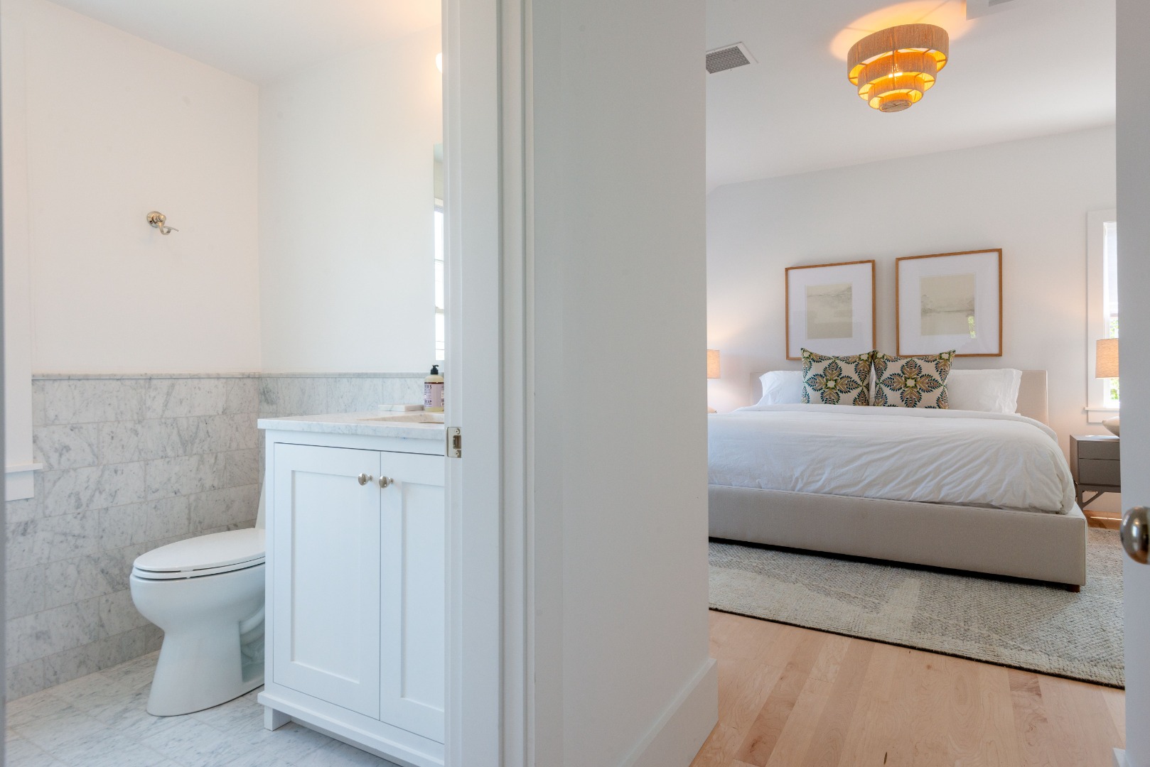 12 Willard Street Nantucket, MA 02554 - Photo 26 of 36 a bedroom with a bed and painting on the wall