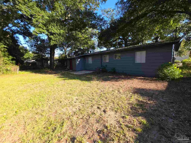 a backyard of a house with lots of green space