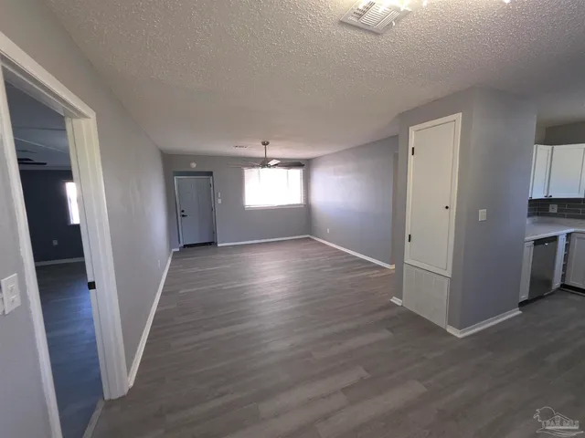 a view of entryway with wooden floor