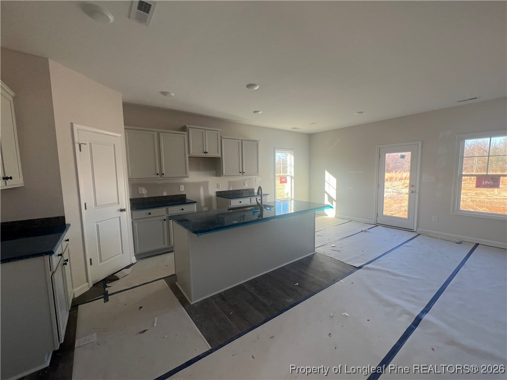 4075 Blue Springs Red Springs, NC 28377 - Photo 10 of 28 a kitchen with refrigerator and window