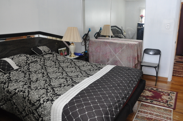 8900 David Place, Unit 1F Des Plaines, IL 60016 - Photo 12 of 13 a bedroom with a bed and dresser