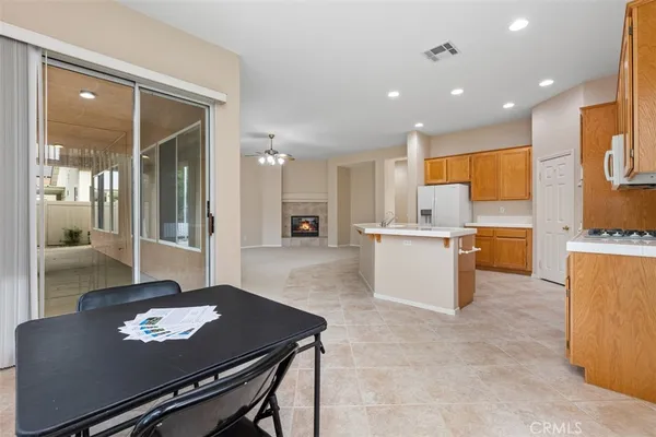 a bathroom with a tub a double vanity sink a vanity and a large mirror