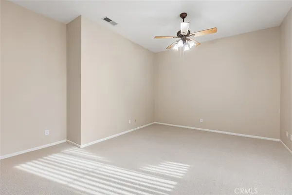 a large white kitchen with a large window