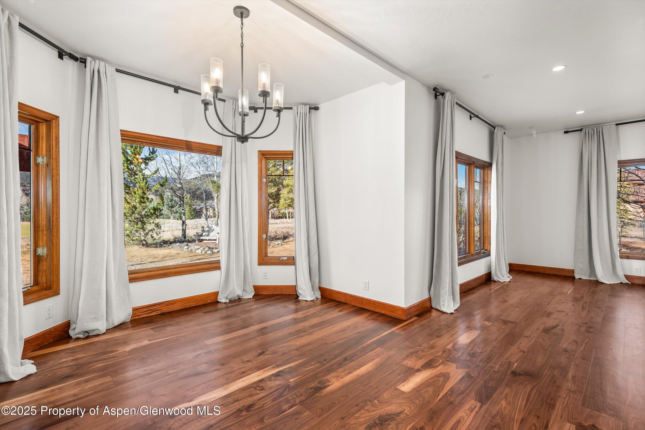 75 Buffalo Lane Carbondale, CO 81623 - Photo 11 of 49 a view of empty room with wooden floor and fan